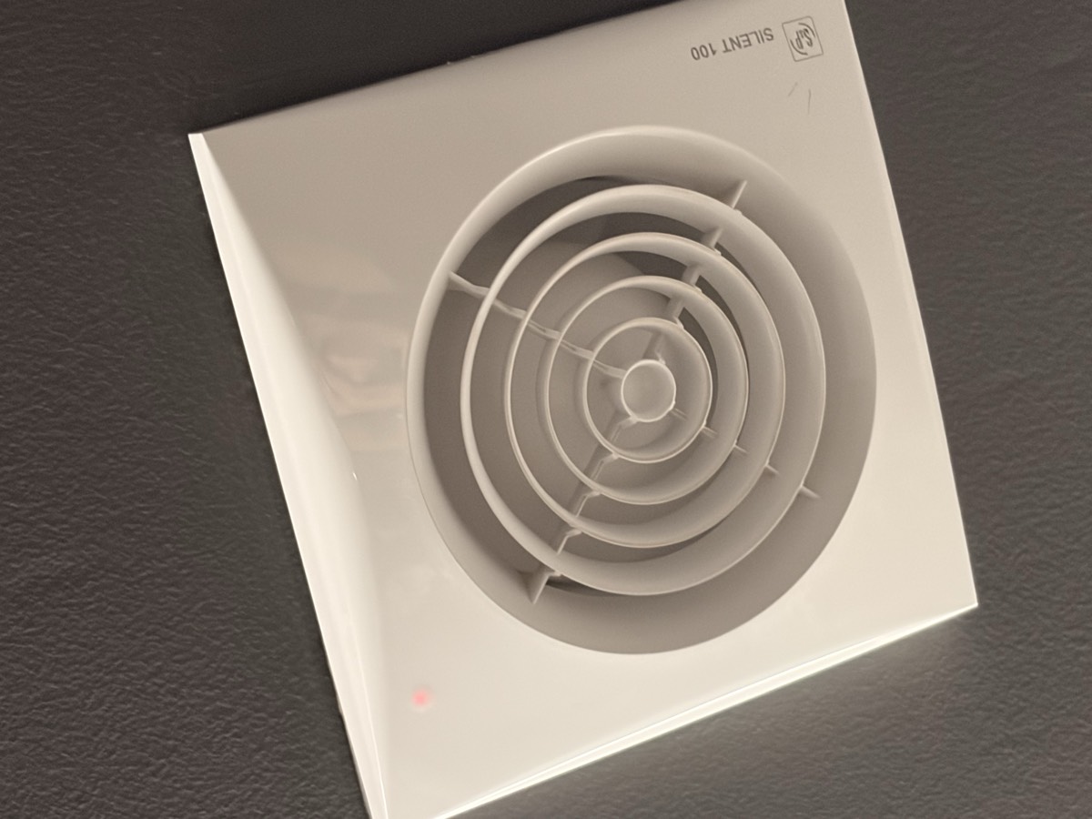 Bathroom exhaust fan mounted on ceiling